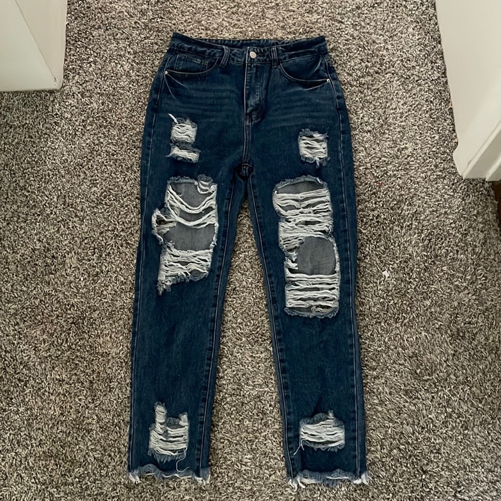 High waisted ripped raw hem jeans